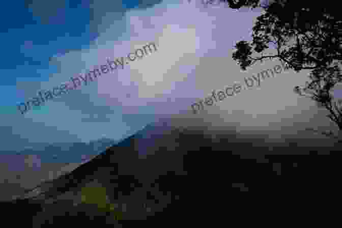 Hikers Reaching The Summit Of Blue Mountain Peak, Enveloped In A Blanket Of Clouds Climbing The Blue Mountain: Take The Next Step On Your Spiritual Journey