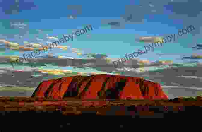 View Of Uluru (Ayers Rock) At Sunset With Orange And Purple Sky. Australia (Countries Around The World)